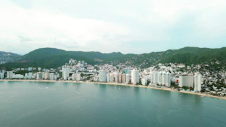 city buildings near body of water during daytime
