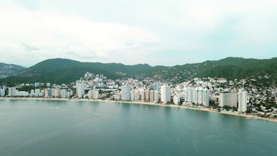city buildings near body of water during daytime
