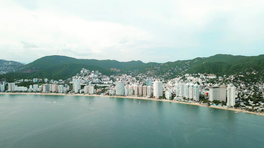 city buildings near body of water during daytime