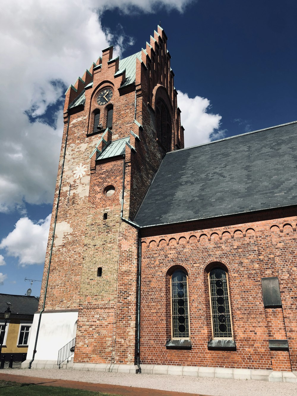 brown brick building under blue sky during daytime