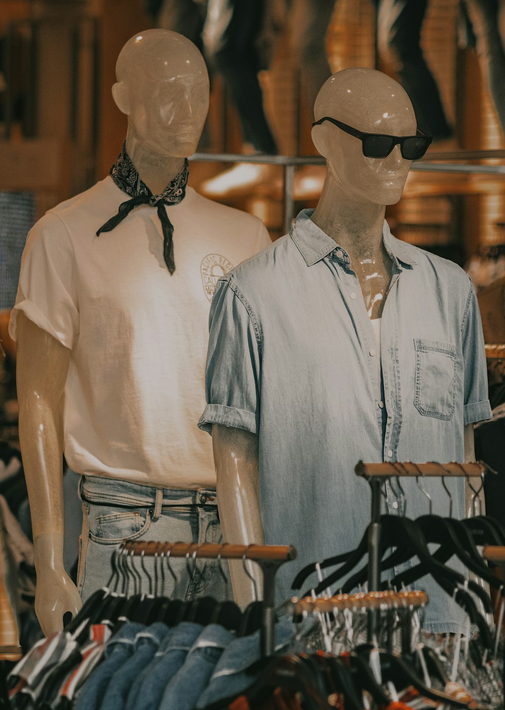 man in blue button up shirt wearing black sunglasses