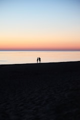 A romantic setting for a honeymoon getaway, featuring a beach sunset.