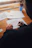 person writing on white paper