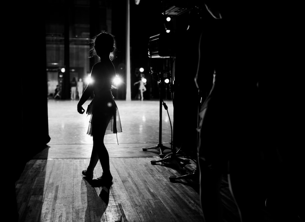 silhouette of woman walking on the street