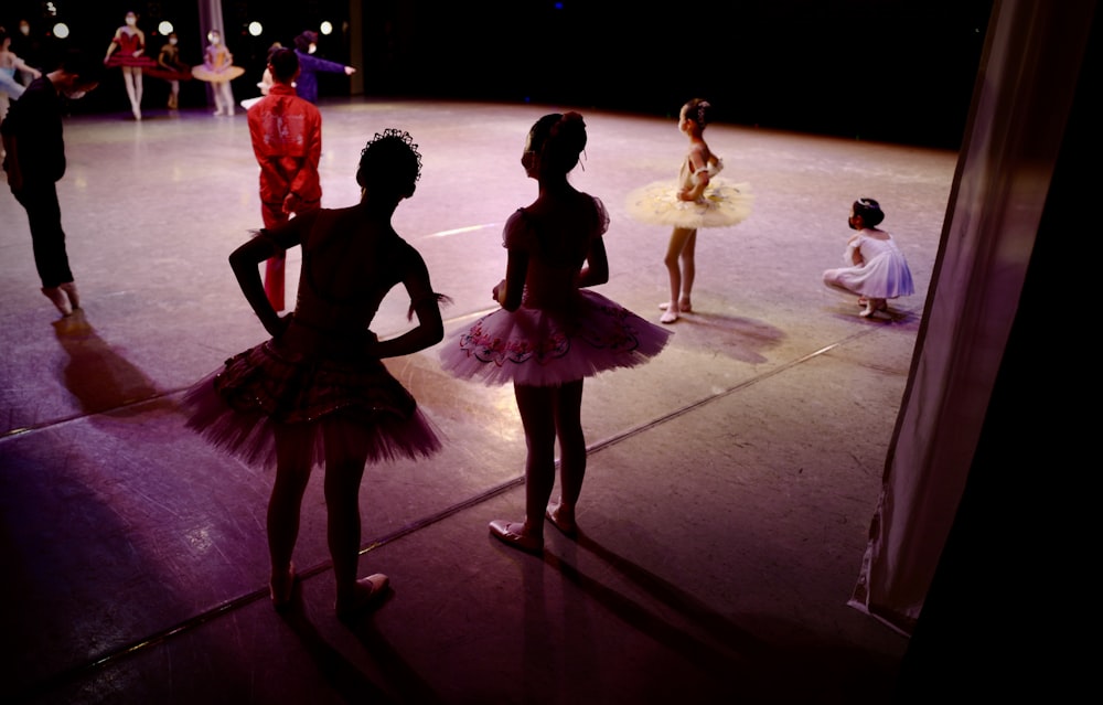 woman in pink dress dancing on stage