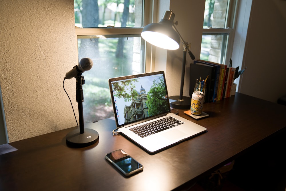 macbook pro on brown wooden table