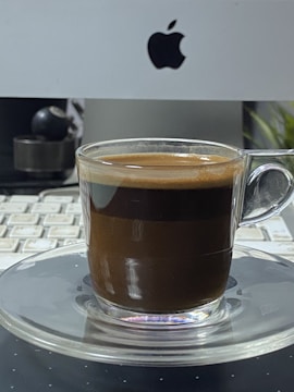 Office desk scene featuring a mechanic’s tools with a coaster promoting awareness next to a cup of coffee.