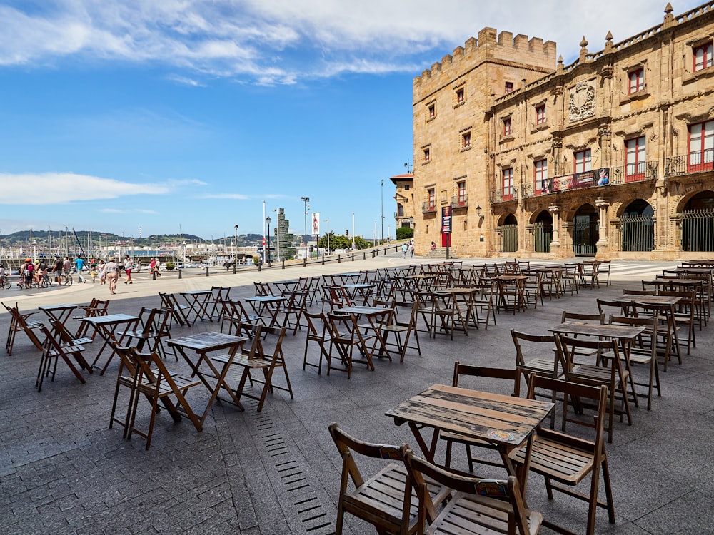 brown wooden table and chairs on a sunny day