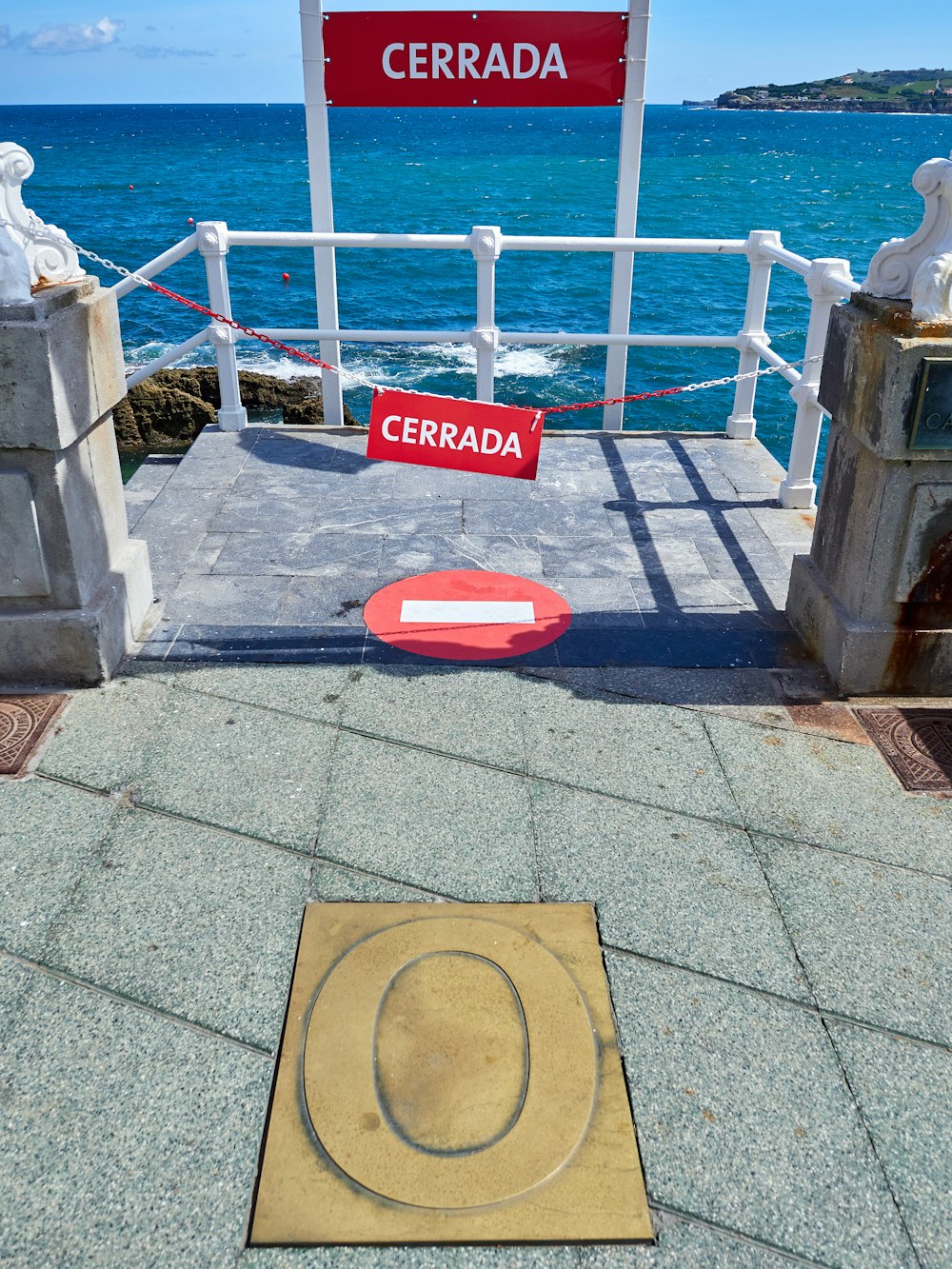 red and brown stop sign on gray concrete floor