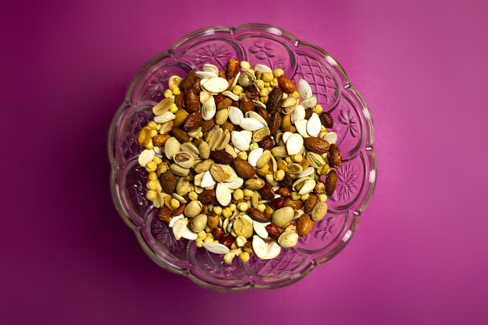 brown and white nuts on clear glass bowl