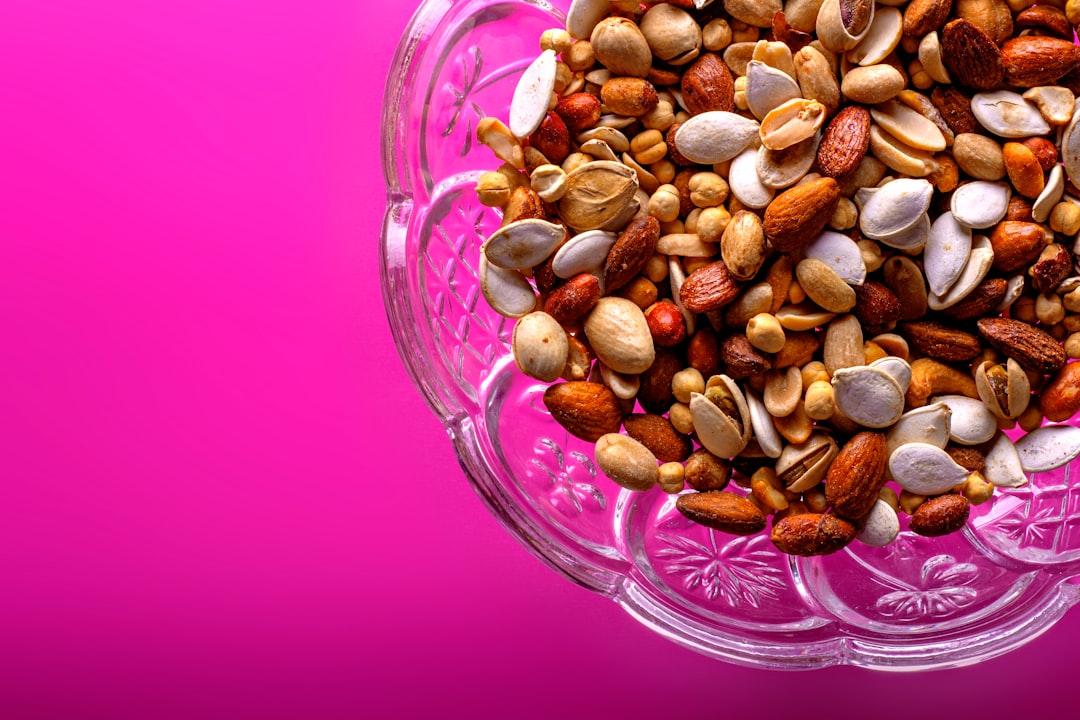 brown almond nuts on clear glass bowl