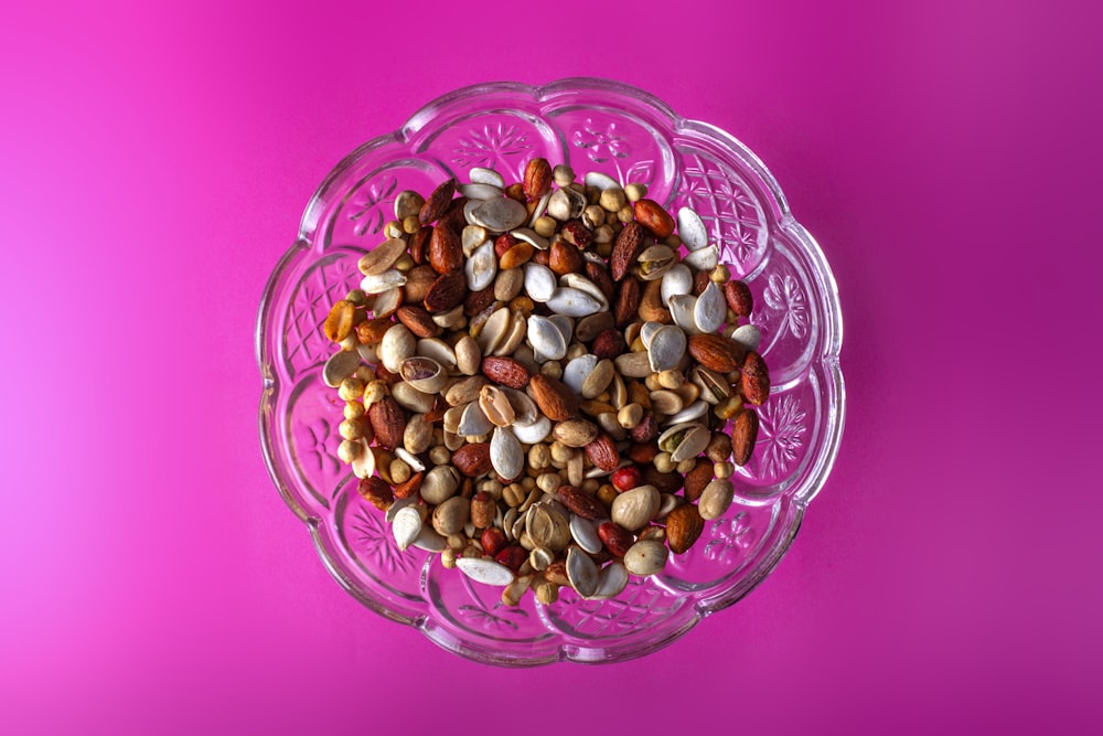 brown and white beans in clear glass bowl
