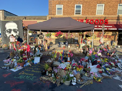 people in front of brown and white concrete building during daytime