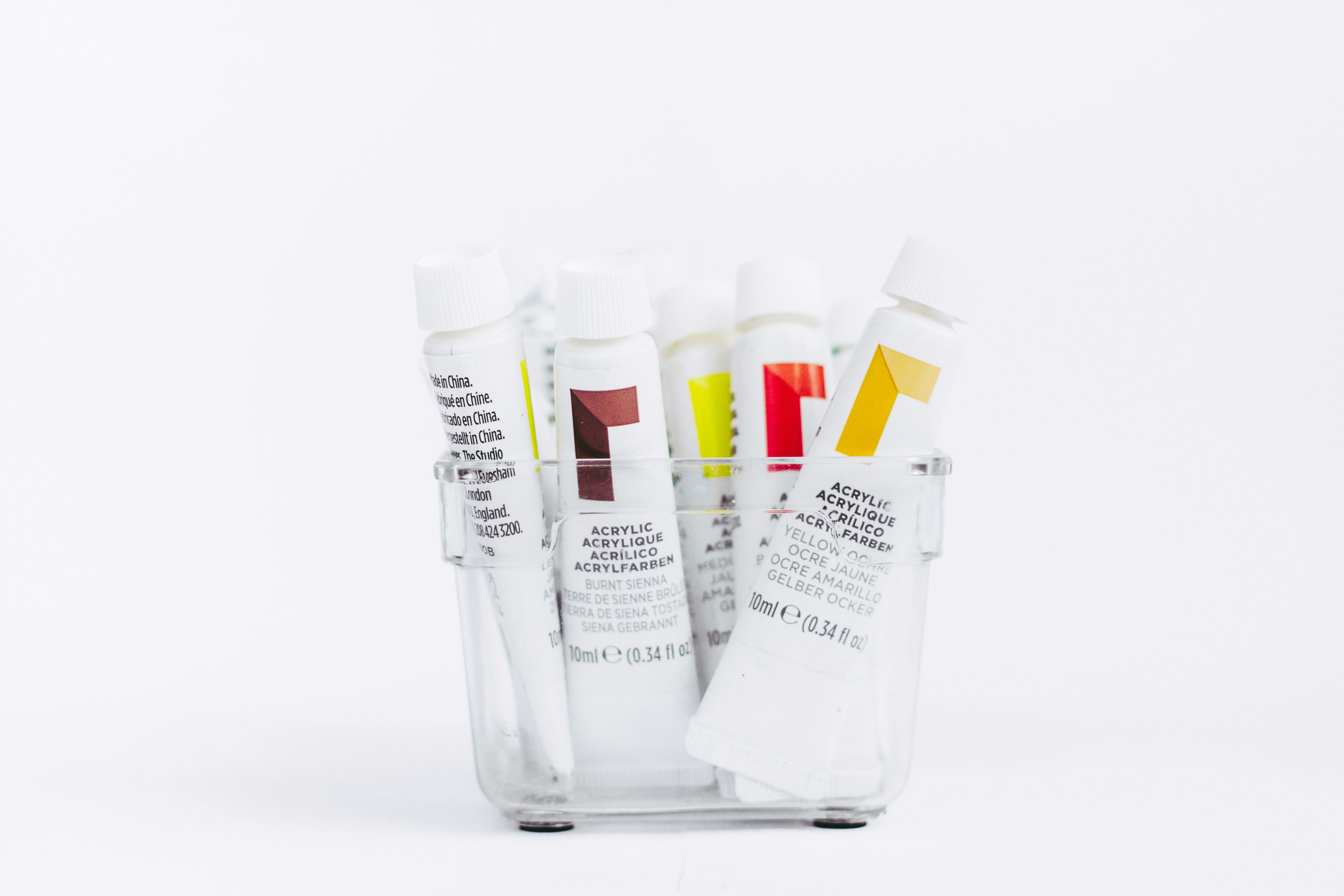 white and yellow plastic tube bottles