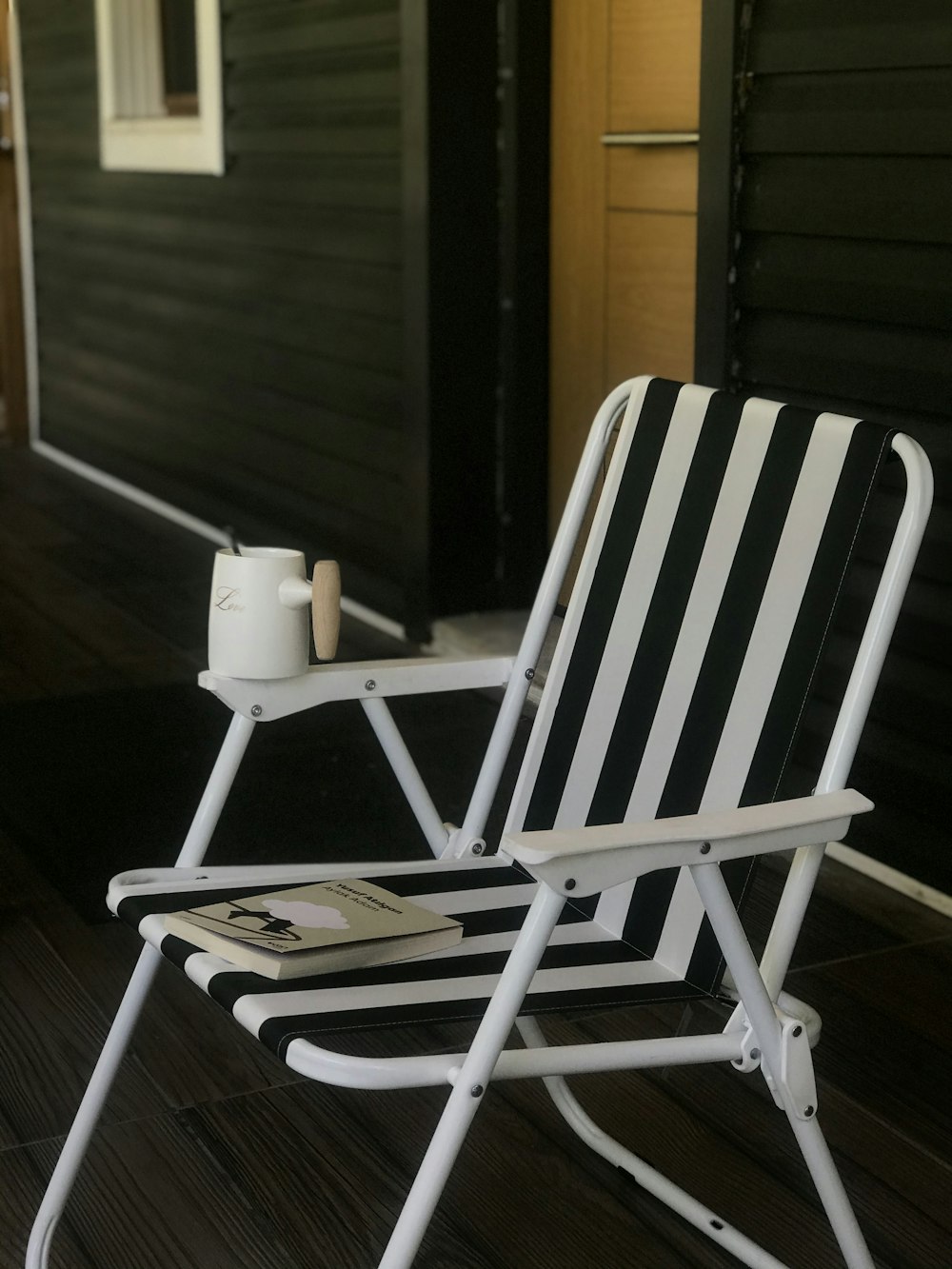 white and brown striped folding chair