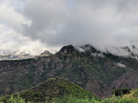 green mountain under white clouds during daytime in Haghpat Armenia