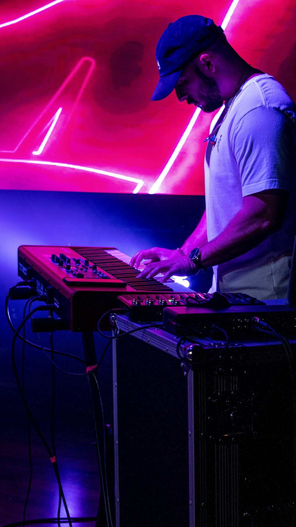 man in white t-shirt playing dj mixer