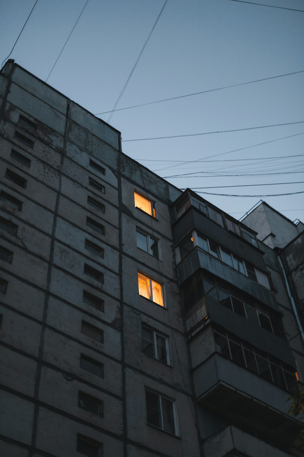 brown concrete building under gray sky