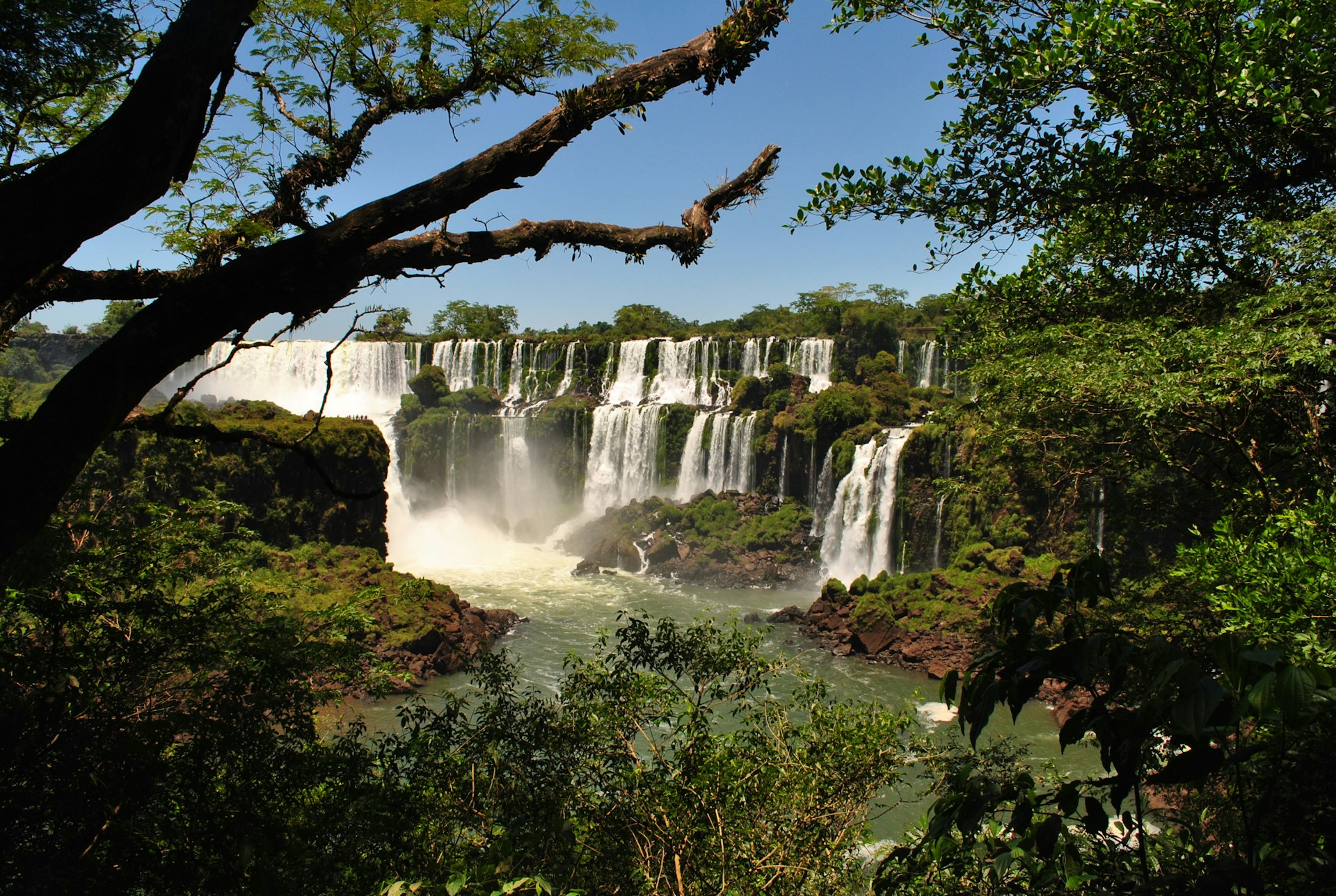 waterfalls under blue sky during daytime