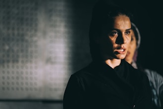 man in black shirt wearing eyeglasses