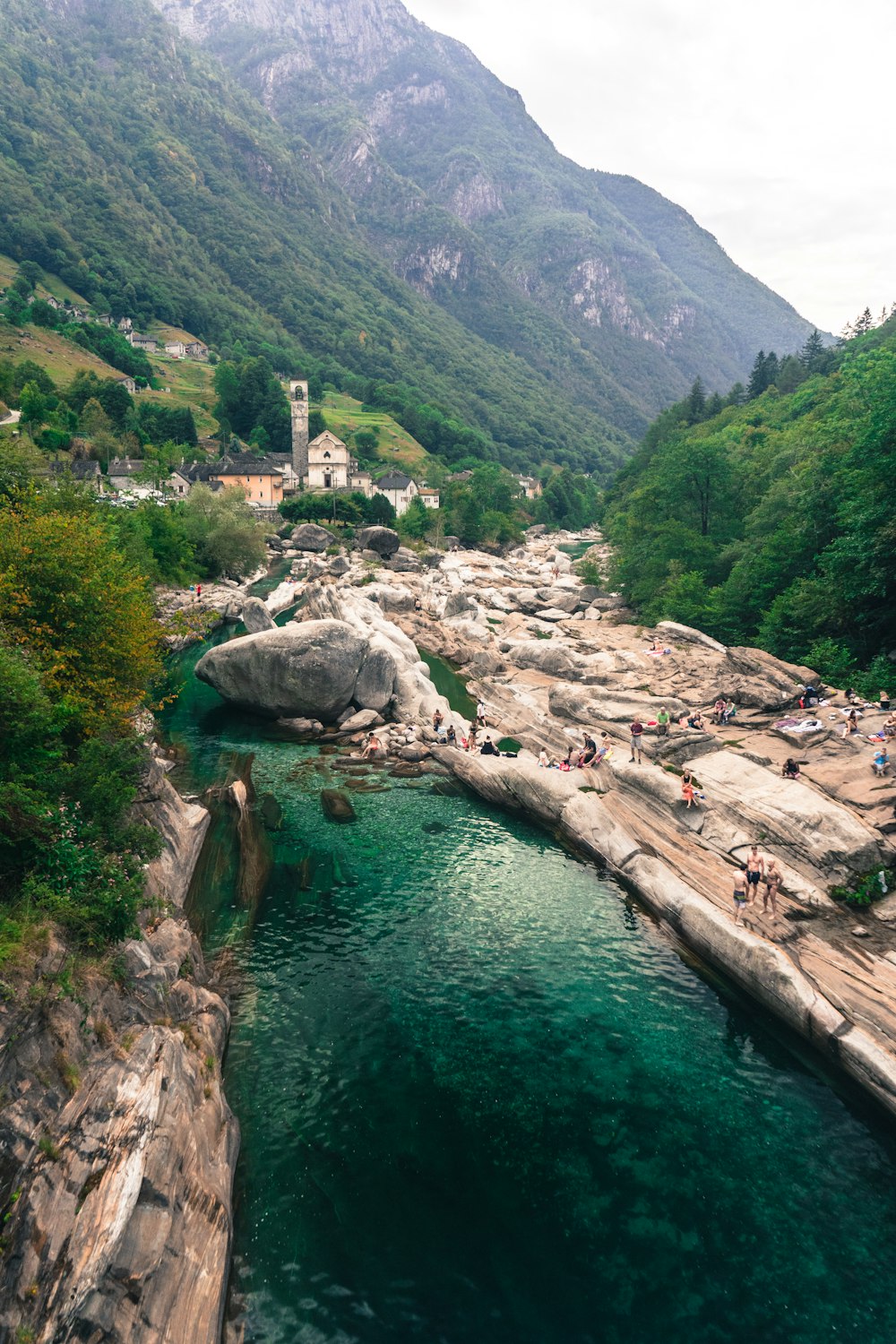 body of water between mountains during daytime