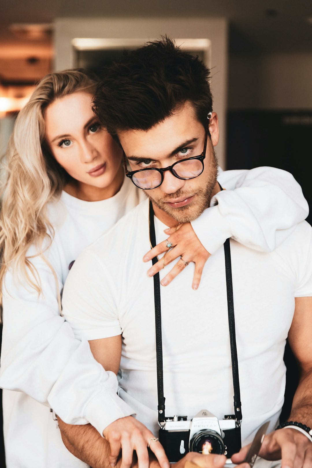 woman in white dress shirt wearing black framed eyeglasses