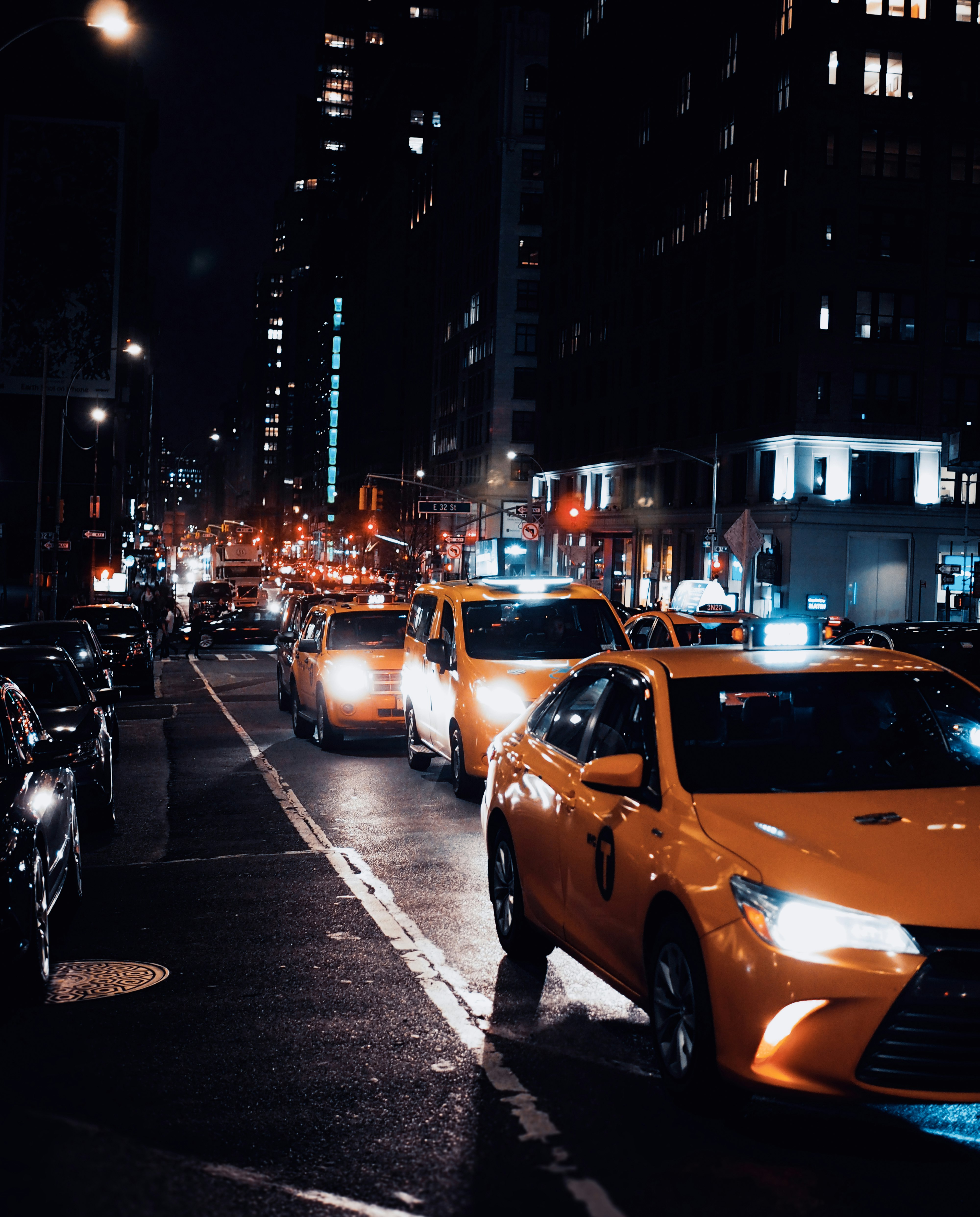 cars parked on sidewalk during night time