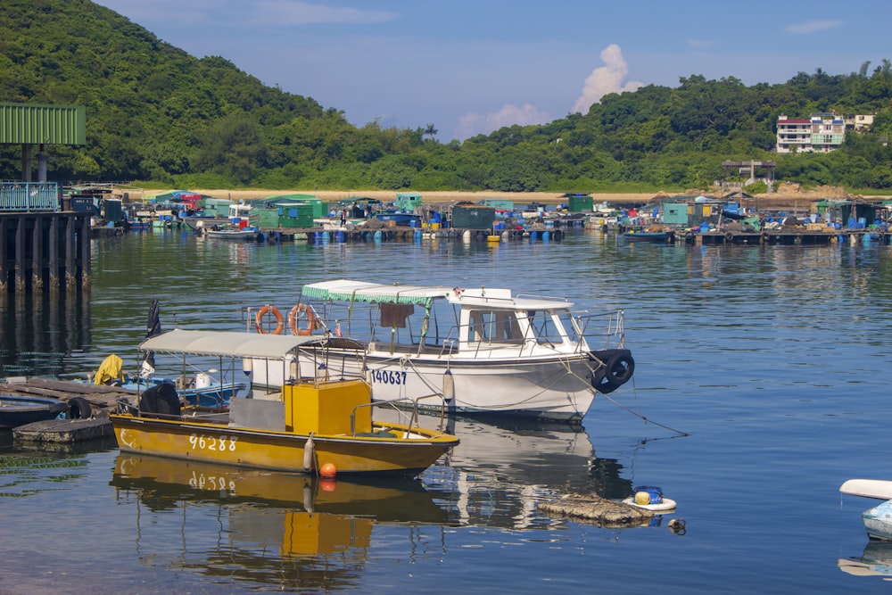 yellow and white boat on water during daytime