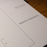 A close-up view of a planner page designed for nightly reflections. The page features sections titled 'Nightly Routine' and 'Nightly Thoughts', with checkboxes and lines for writing.