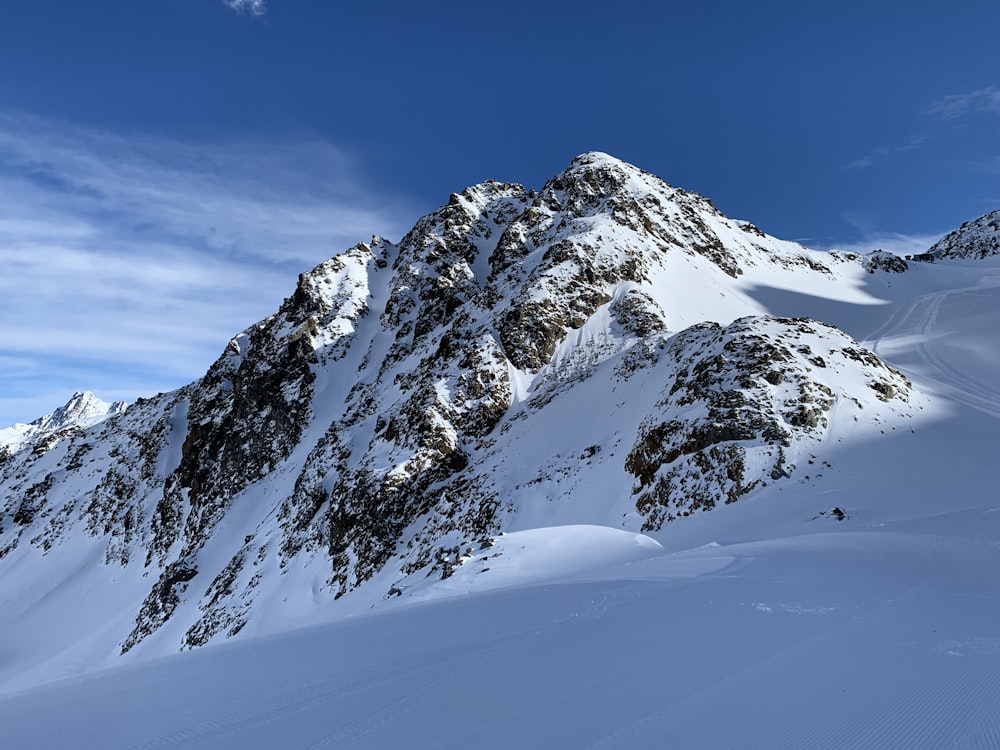 snow covered mountain under blue sky during daytime