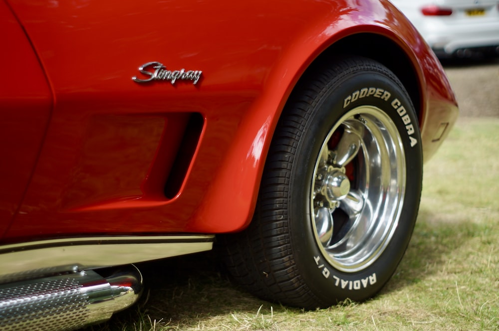 red car with chrome wheel