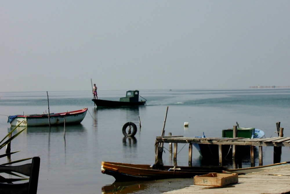 brown wooden dock on sea during daytime