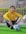 boy in yellow sweater and black pants sitting on soccer goal net
