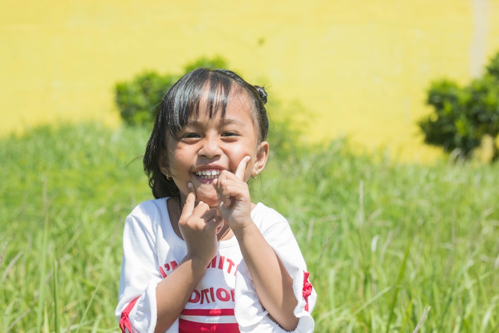 girl in white and red crew neck t-shirt