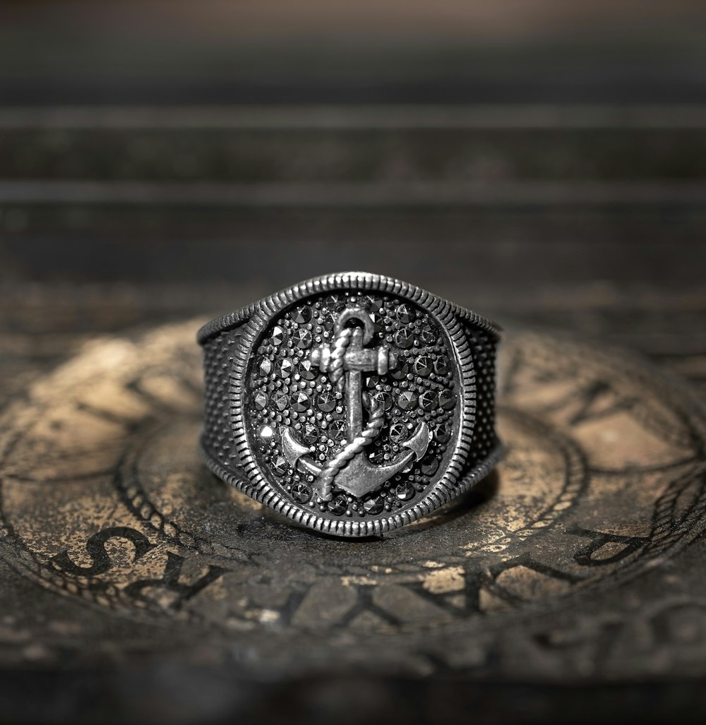 silver and black round coin