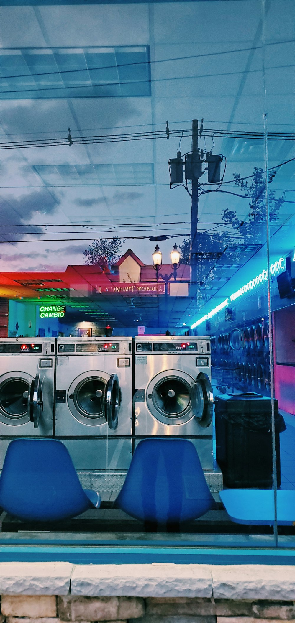 front load washing machines near building during night time
