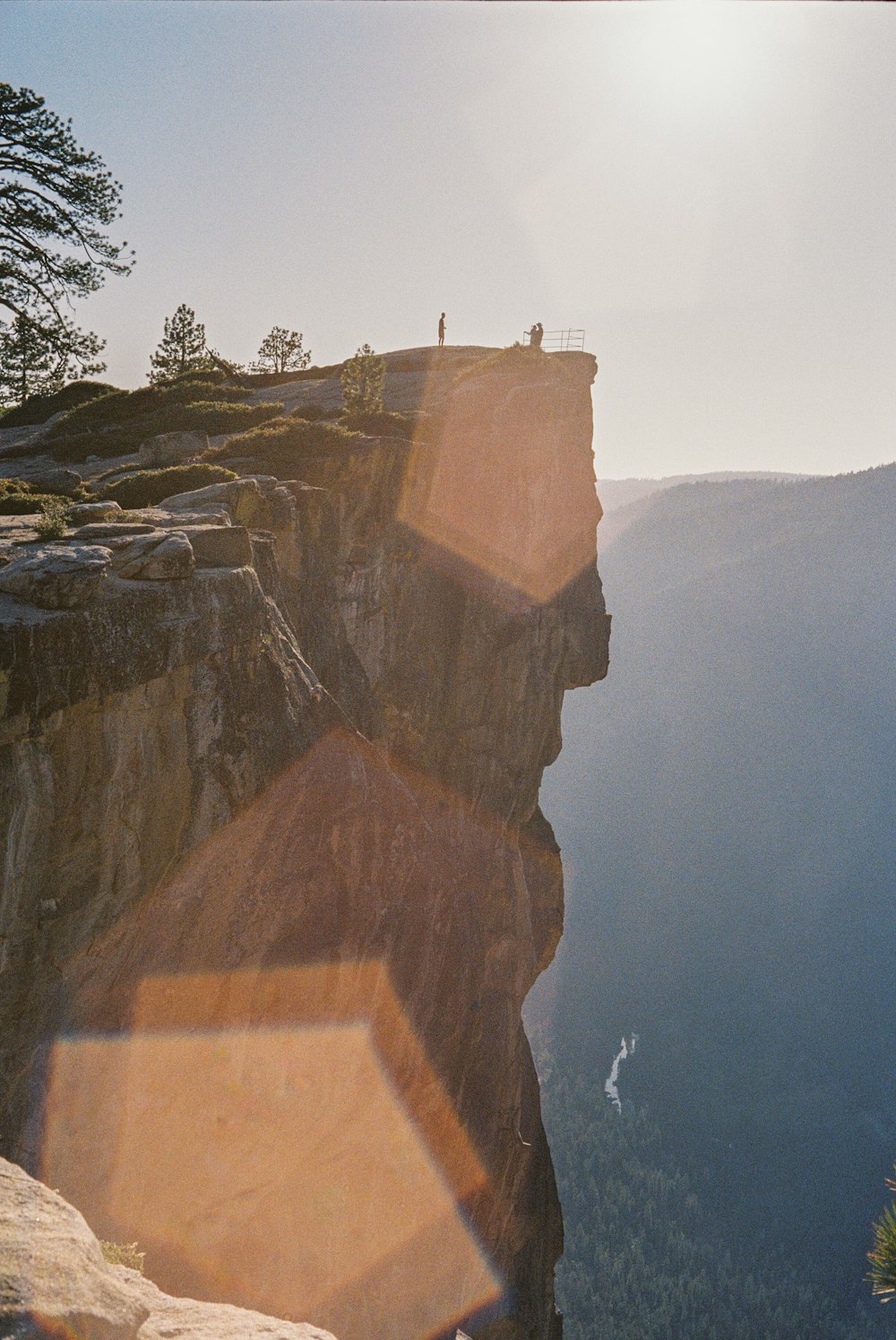 brown rock formation near body of water during daytime