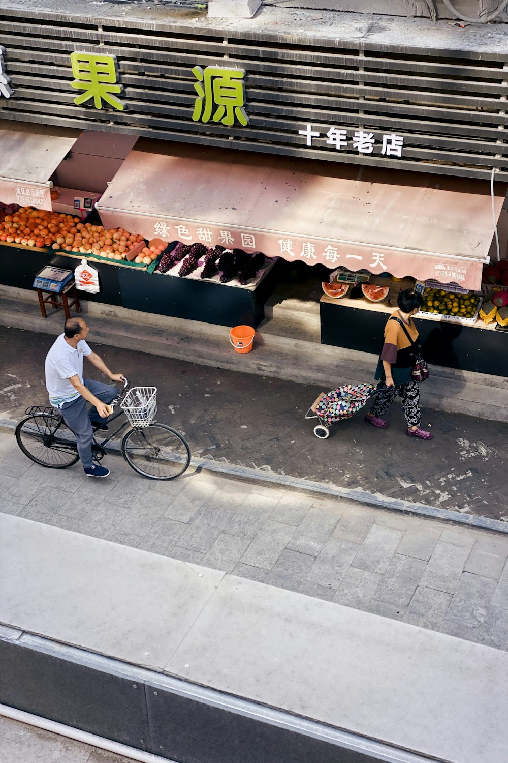 man in white t-shirt riding on bicycle