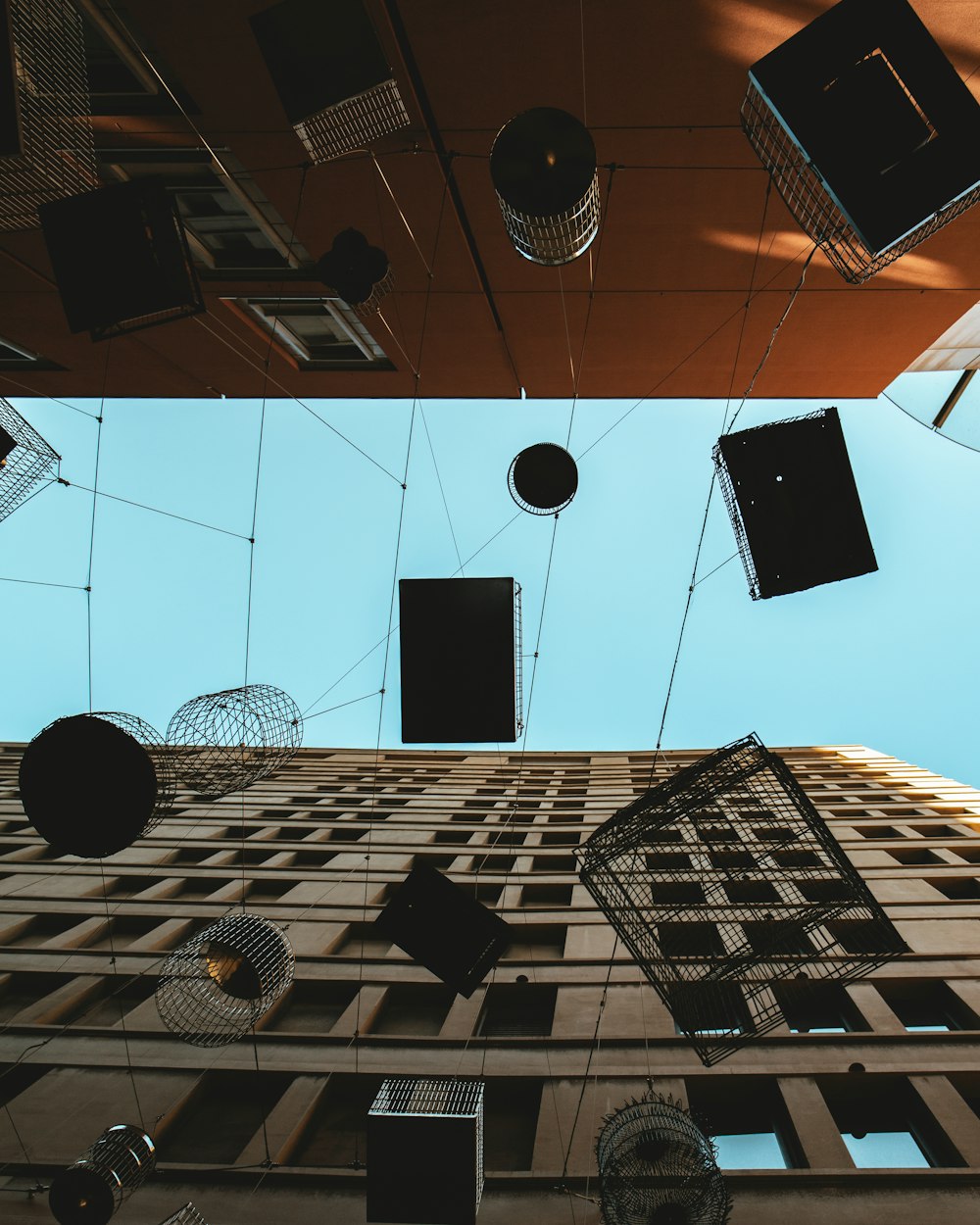 a group of square objects hanging from the ceiling