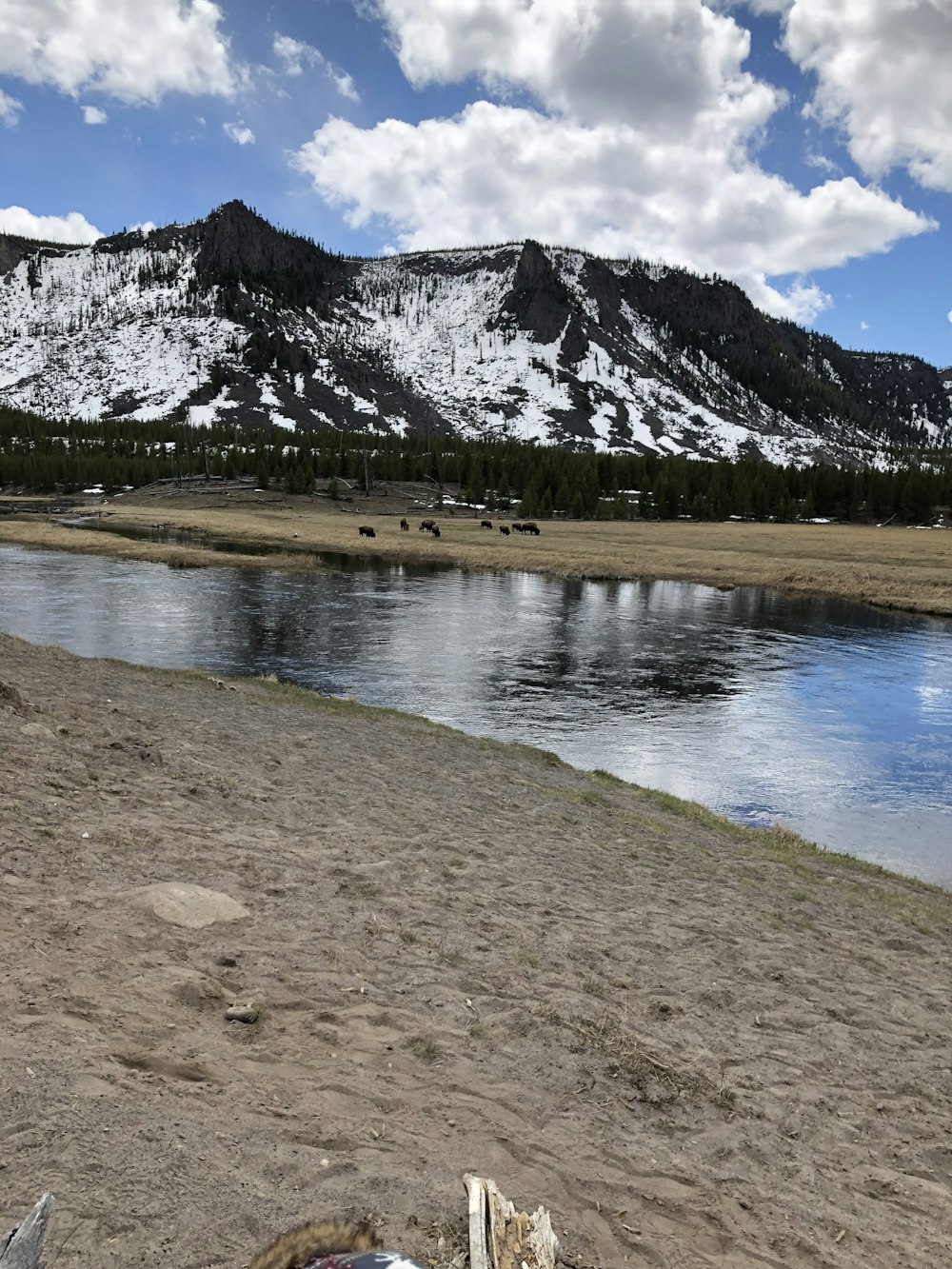 lake near snow covered mountain during daytime