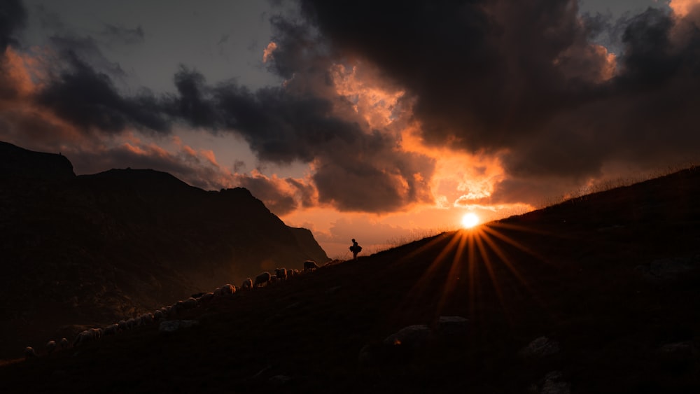 silhouette of mountain during sunset