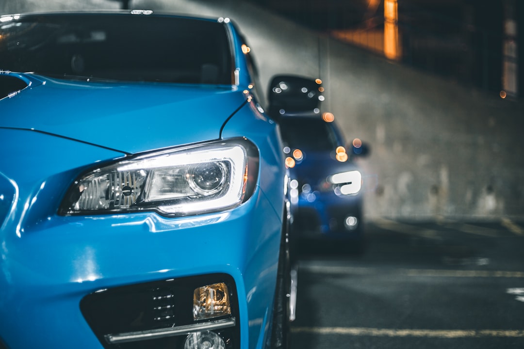 blue car in the city during night time