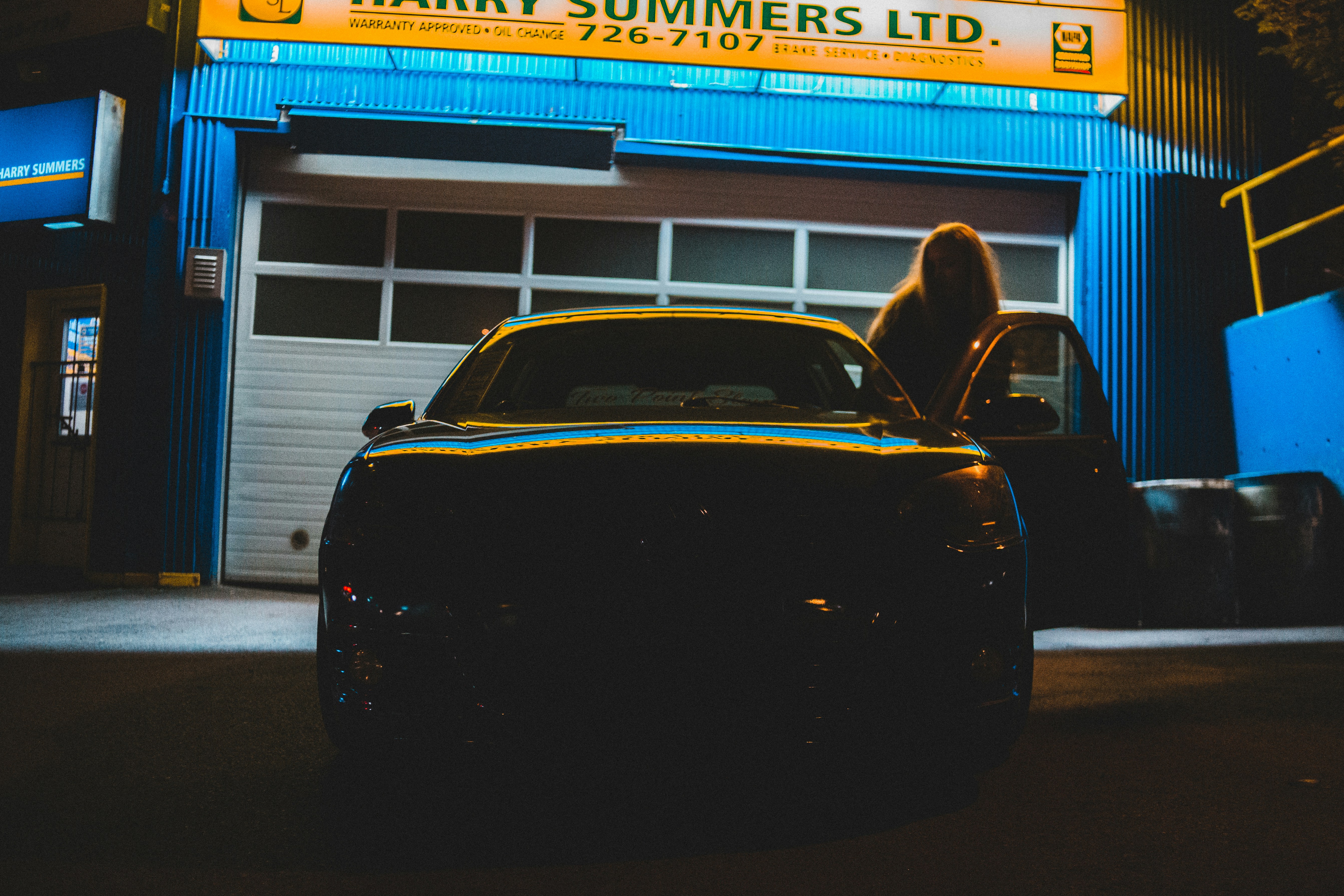 black car in front of store