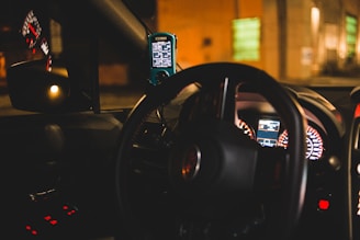 black steering wheel in close up photography