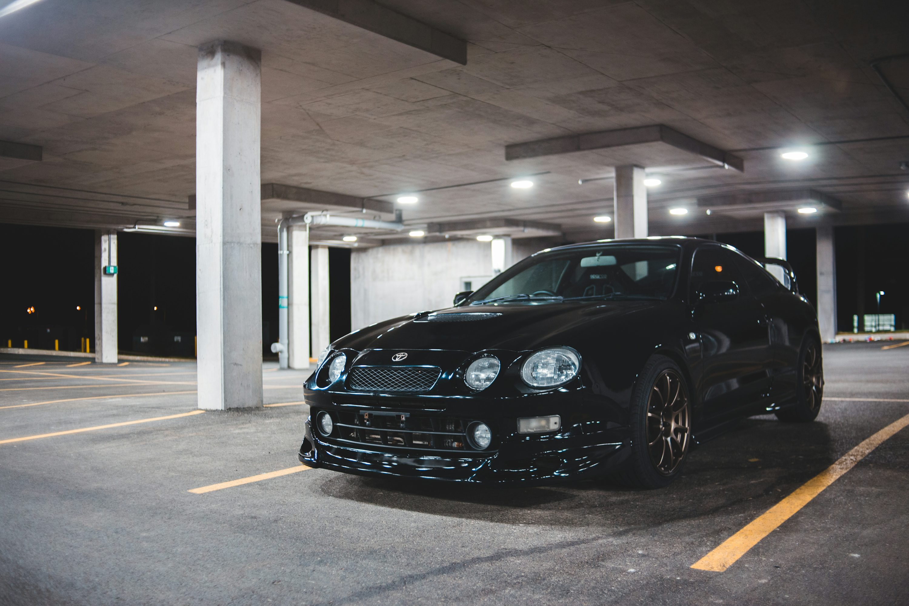 black bmw m 3 parked in garage
