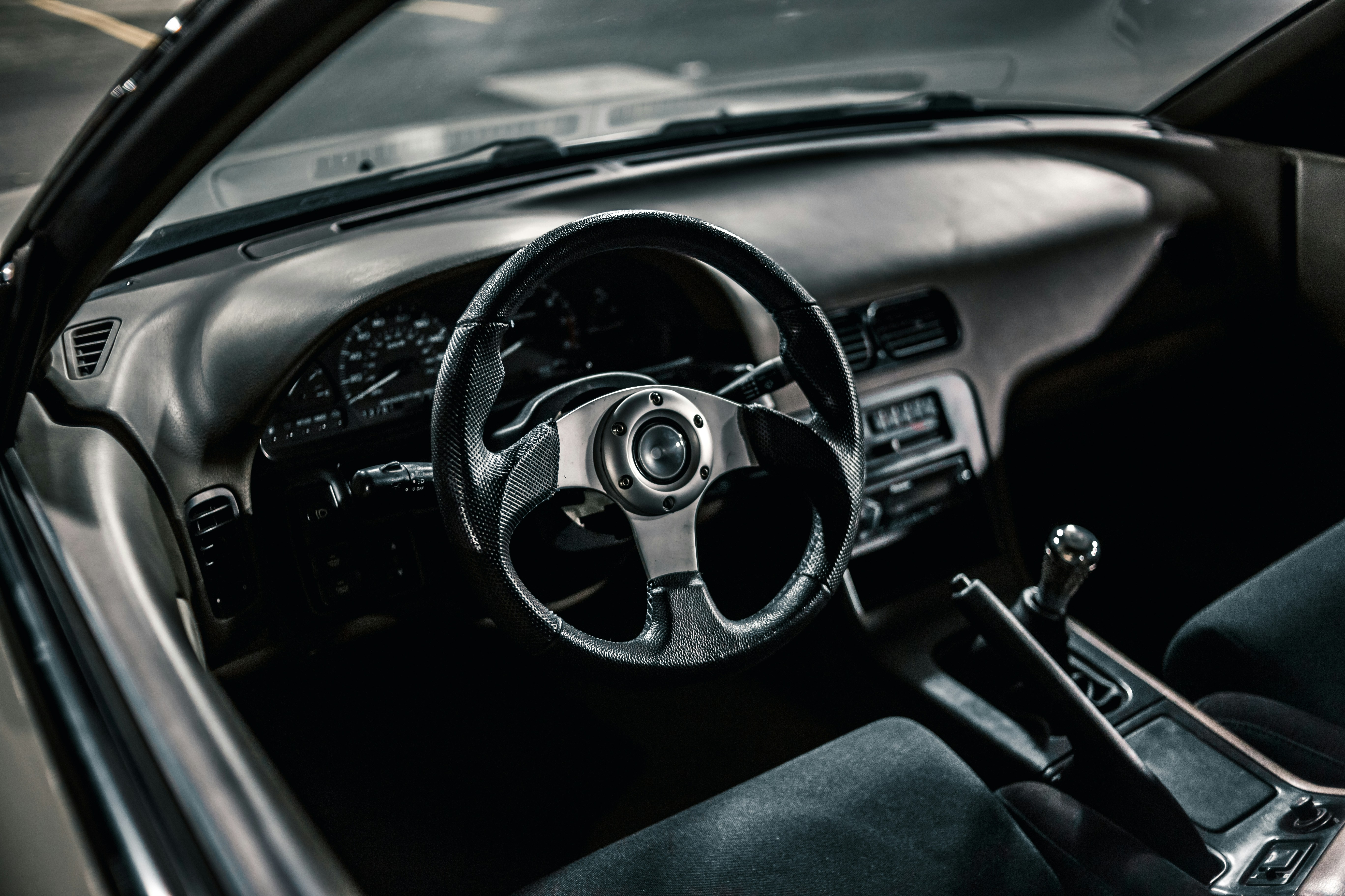 black and silver steering wheel