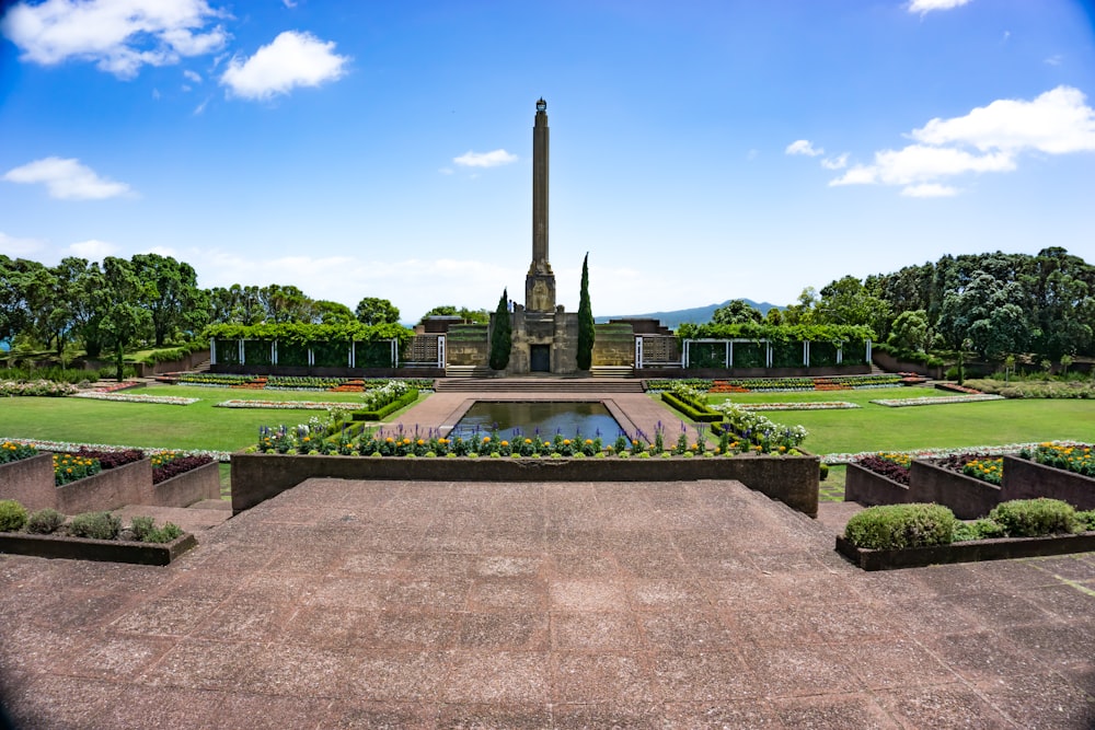 gray concrete fountain under blue sky during daytime