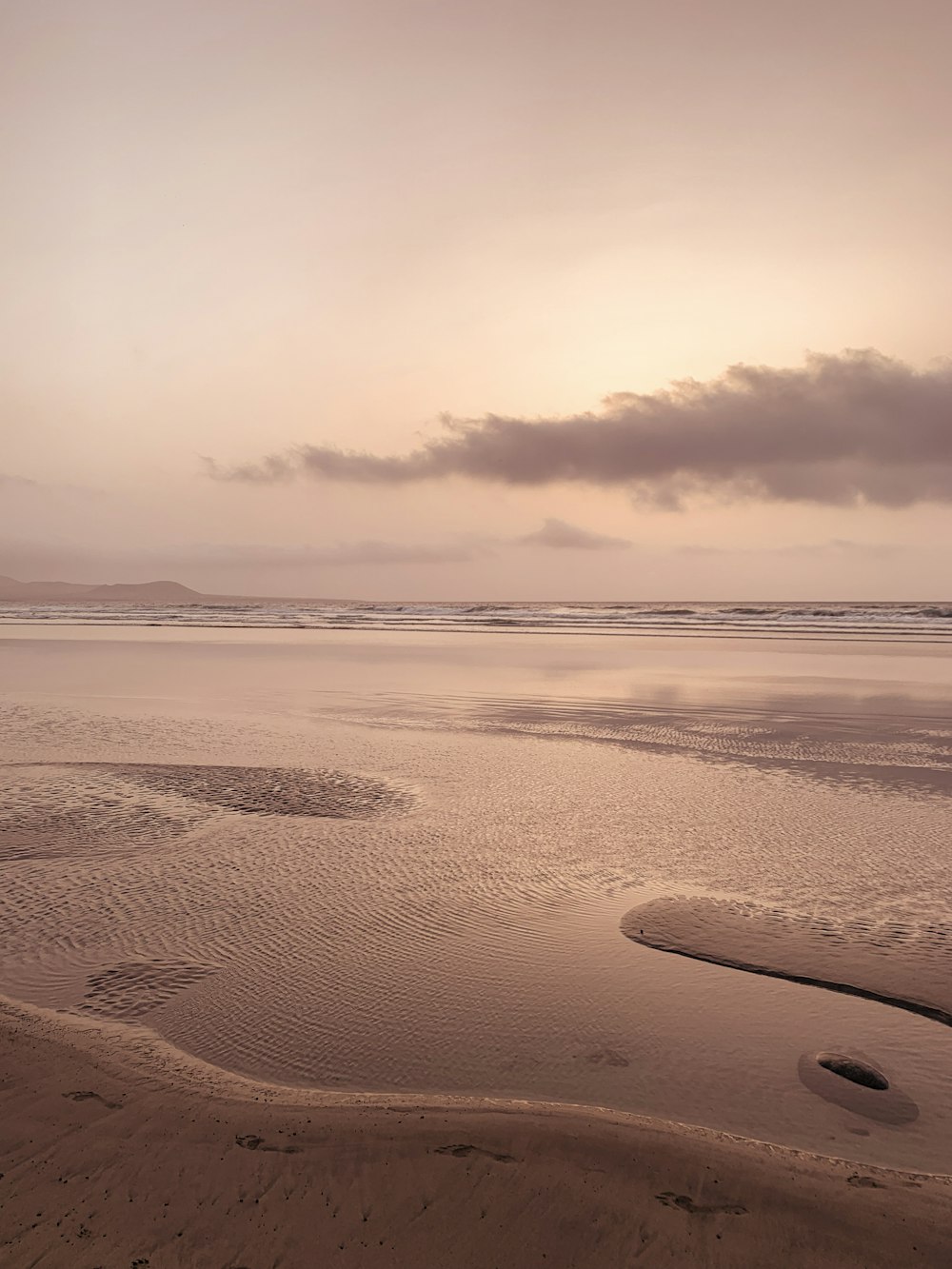 brown sand under cloudy sky during daytime