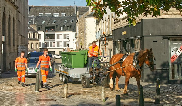 A horse-drawn cart at work in the old town — Quimper, France