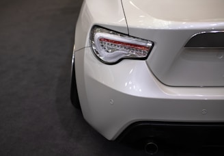 white car with red license plate